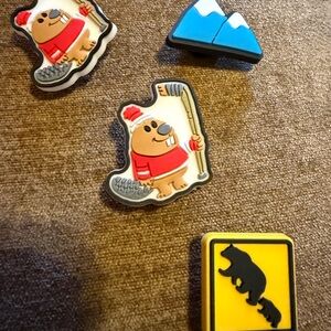 4 Kids' shoe charms with Canadian(beaver, hockey mountain,& bear).4 for $8.